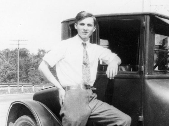 Picture of Herman Baker in front of his car
